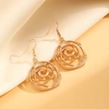 Exaggerated gold swirl rose earrings set on elegant silk fabric background - KC Gold Earrings (7487)