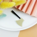 Detail of miniature black and gold acrylic axe charms for DIY Halloween jewelry making - Gold