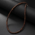 Detail of vintage coconut shell and turquoise beaded necklace on a black display stand - Solid Brown Coconut Shell