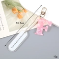 Pink marble texture acrylic letter F keychain with silver clasp and floral postcard background - Letter F