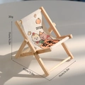 Mini wooden folding chair phone stand with 2025 cartoon pattern and size dimensions - Year of the Snake