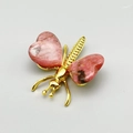 Golden dragonfly ornament featuring natural pink crystal heart-shaped wings - Rhodonite