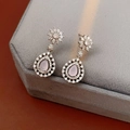 Detail view of silver drop earrings with pink zircons and small diamonds on grey velvet box - Flower Water Drop Stud Earrings / Silver-Pink