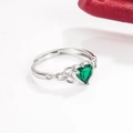 Silver ring featuring a heart-shaped green emerald zircon and celtic knot detailing - Emerald