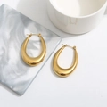 Minimalist 18k gold plated teardrop U-shape hoop earrings on a marble decor background - Oval/Teardrop