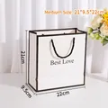 Elegante weiße Geschenktüte aus Papier mit schwarzem Rand und Best Love Text für Geschenke - Mittel / Weiß