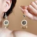 Detailed view of bohemian seashell tassel earrings with pearls and black stones - Gold-Black Style (3# Ear Hook)