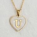 Golden heart necklace with shell inlay and letter U pendant on white fabric background - Letter U / Gold