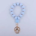 Dettaglio portachiavi in perline di silicone azzurro con distanziatori in strass e chiusura - Blu