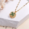 Golden titanium steel necklace featuring a rotating green stone clover pendant with crystals - Rotating Green
