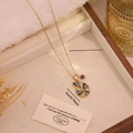 Goldene Edelstahlkette mit blauem Muschelanhänger und kleiner lila Perle - Schnecke Stil (1#Sea Snail)