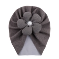 Detailed close-up of brown baby turban hat with large pearl flower decoration - Gray