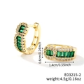 Detail view of gold huggie earrings featuring green rectangular gems and white crystals - Gold Base-Green Zirconia