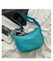 Detailed shot of a blue nylon hobo bag with a daisy charm on a white fabric background - Mini Shoe Charm Style / Blue