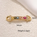 Macro detail of a 34mm gold jewelry connector with colorful stones and dimensions - Colorful Zircon Linker