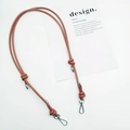 Detail of adjustable brown leather shoulder strap with knot design and silver metal hooks - Silver Plate Hook / Tan