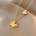 Elegant gold double-layered butterfly necklace on soft brown silk satin background - Titanium Steel Gold Style (X125)