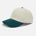 Detail of retro corduroy baseball cap with beige crown and contrasting dark green brim - Dark Green