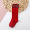 Detail of red knee high kids socks with green bow on woven mat for Christmas - L 1-3 Years Old / Red (Red Green Single Bow)