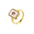 Detail of 18K gold-plated ring with mother of pearl base and purple zircon center - Oval Purple Zirconia Ring