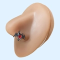 Detail of gothic black bat nose stud with red heart-shaped gemstone on model - Black Bat Red Heart Style
