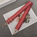 Detail of colorful woven shoulder strap with pixel pattern and gold metal lobster clasps - Red Brown Pink + Gold Hook