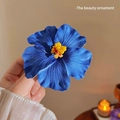 Delicate blue hibiscus flower hair clip with yellow stamen for seaside hairstyling - Blue Hibiscus