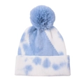 Close-up of blue tie-dye knit texture and large faux fur pompom on outdoor winter beanie - Adult One Size / Tie-dye Light Blue