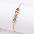 Macro detail of gold metal bracelet featuring colorful rectangular cubic zirconia crystals - Rainbow Round Discs Style (款式五)