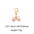 Pink enamel bow pendant with golden lobster clasp and precise size dimensions - Style 36 Mini Bow