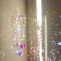 Macro shot of diamond metal frame with heart crystal prism reflecting rainbow light - Four-sided Metal Frame + Heart