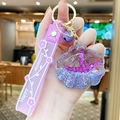 Llavero de concha estrella de mar lila con colgante de purpurina y pulsera de silicona - Morado