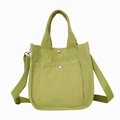 Minimalist light green canvas tote bag with adjustable shoulder strap and silver buttons - Green