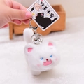 Funny fluffy white cat plush keychain with pink ears and a silver bell on a backpack - Sitting Style / White
