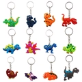 Set of 12 colorful PVC dinosaur keychains with 3D cartoon patterns on white background - Keychain