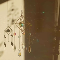 Macro detail of crystal suncatcher snowflake with rainbow light reflections on wall - Metal Frame + Crystal Ball