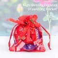 Red organza drawstring gift bag featuring decorative roses and a mesh texture for candies - Red