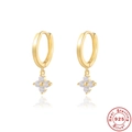 Macro shot of 925 sterling silver four-leaf clover earrings with sparkling white zircons - 925 Silver / Gold-White Zircon