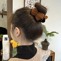Brown plush knit bow hair claw clip for elegant bun hairstyle and ponytail look - Caramel