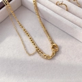 Close-up of gold double-layer necklace with Figaro chain in a jewelry display box - Double Layer Chain Round Buckle