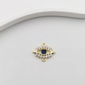 Gold plated evil eye pendant charm with blue and white zircon stones on white background - Blue White Eye Charm BN0195