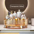 Organizer rotante color ambra da 28 cm per cosmetici con eleganti piedini dorati - Ruotabile a 360° / Giallo Trasparente