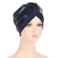 Detail of navy blue sequin turban featuring a cross-over front and shimmering finish - Navy Blue