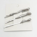 Three-piece silver alloy hair clips set with fluid wave design on white card - 3-Piece Set / White K/Silver