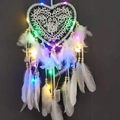 White heart-shaped dreamcatcher with feathers and colorful LED lights on a dark background - White with Colorful Lights