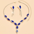 Macro view of blue marquise gemstone necklace and drop earrings set on silver base - 650 Royal Blue