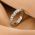 Silver eternity ring with emerald-cut and round zircons on warm camel fabric - Silver Baguette Zirconia Eternity Ring (1238)
