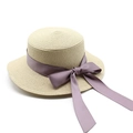 Detail of beige straw boater hat featuring a long lavender purple ribbon bow - M (56-58cm) / Beige