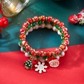 Weihnachts-Armband-Set mit Weihnachtsmann und Schneeflocken-Anhängern auf festlichem Grund - 3er-Set Rot Grün Weiß Baum Schneeflocke Weihnachtsmann