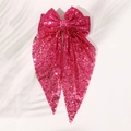 Detail of fuchsia sequin oversized bow hair clip with shimmering reflective surface - Rose Red